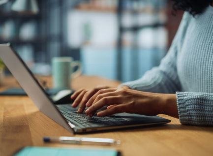 Person typing on laptop